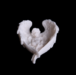 Alabaster angel lying in the wings
