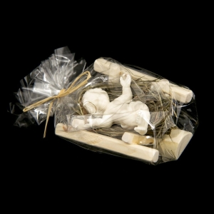 Alabaster Baby Jesus in the wooden manger with hay